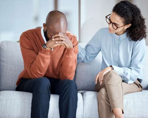 Sad, depression and black man with psychologist help, support and empathy for mental health crying. Counseling, psychology and USA professional woman consulting depressed patient or client problem.